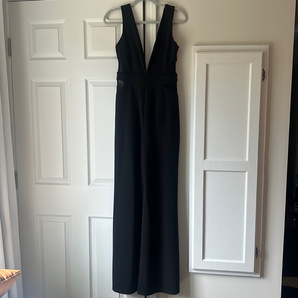 NWT - Vici Dolls Black Jumpsuit with Mesh Sides Flared Legs - Size L runs small
